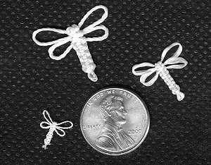 Really small dragonfly knots!  A penny for your thoughts.  :-)